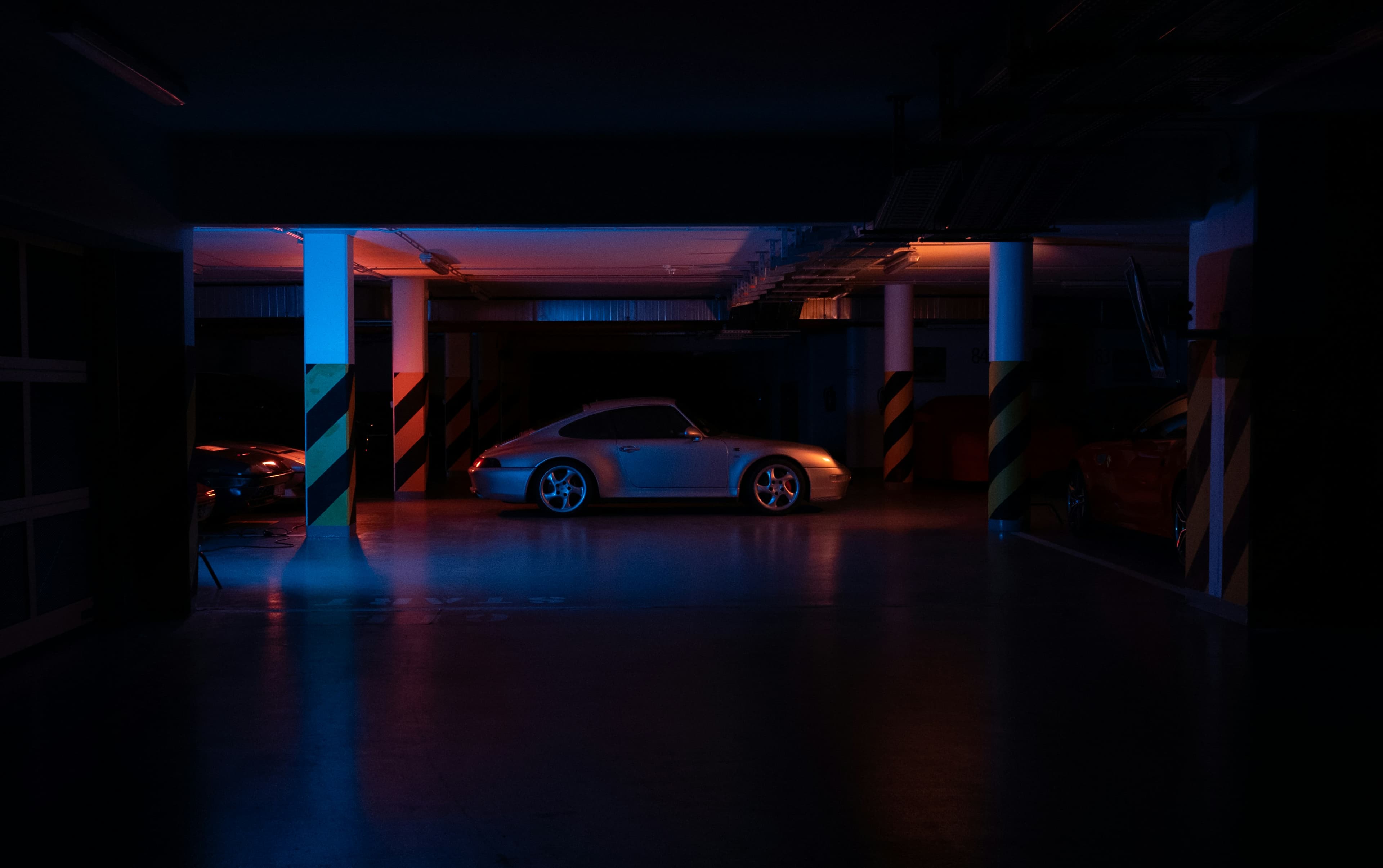 porsche carerra in reb blue light garage